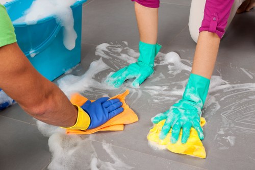 Cleaner working in a modern SW8 apartment living room